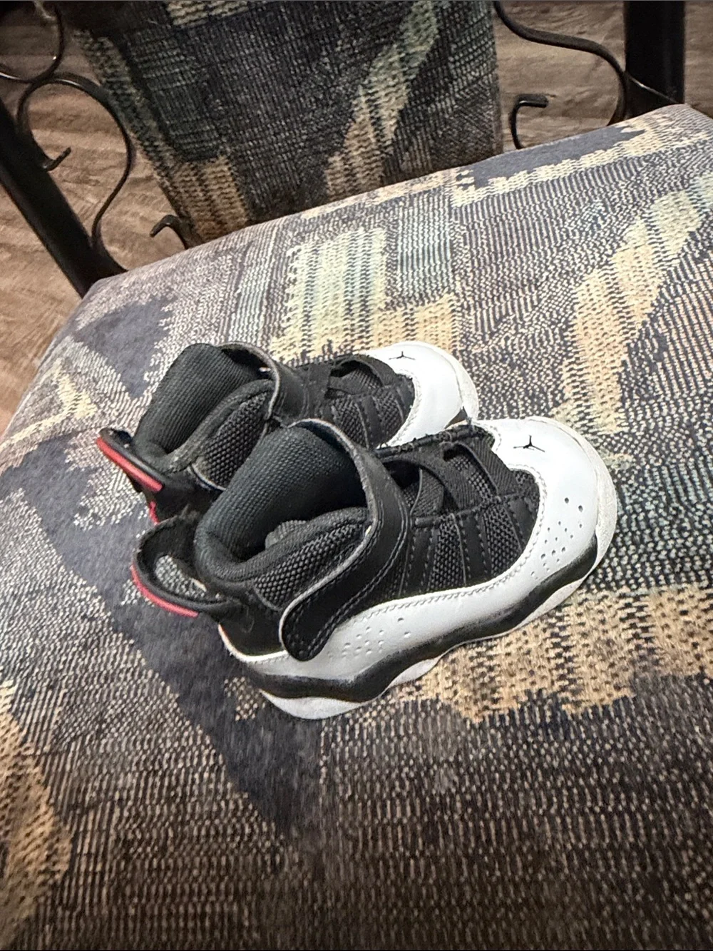 Jordan Kids Black and White High-Top Sneakers with Red Accent